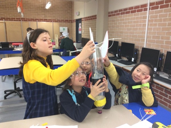 girls participating in aeronautical velocity challenge